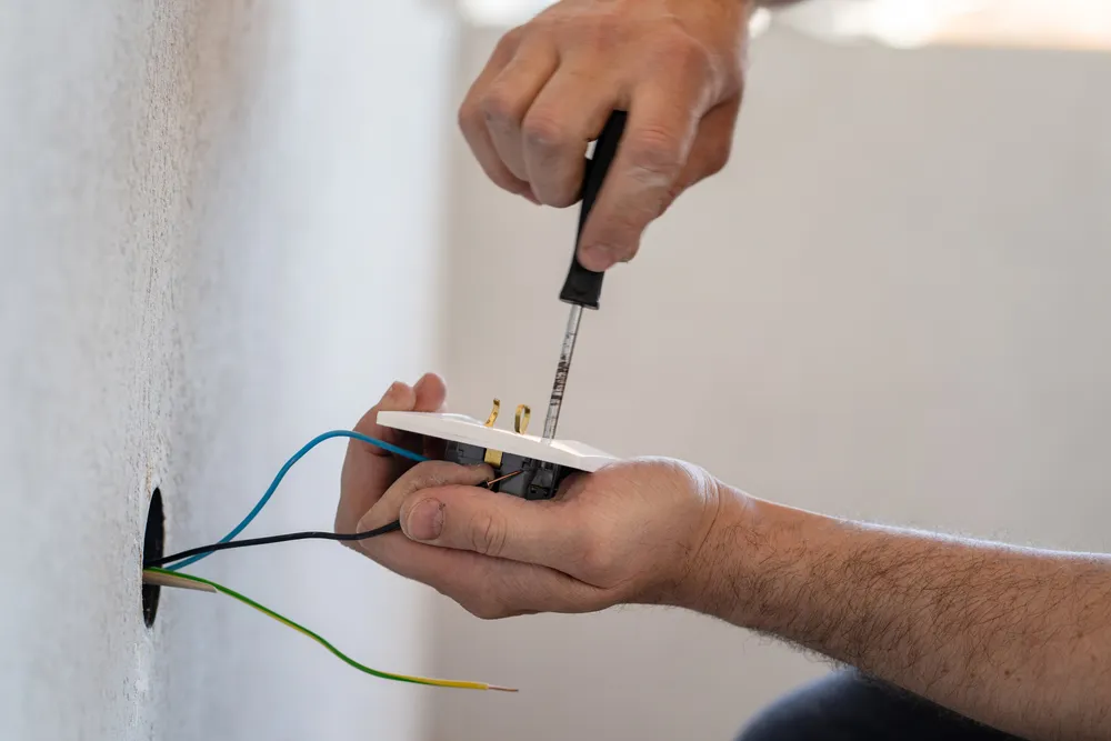 Residential electrician installing pool and shed circuits at a Bella Vista home