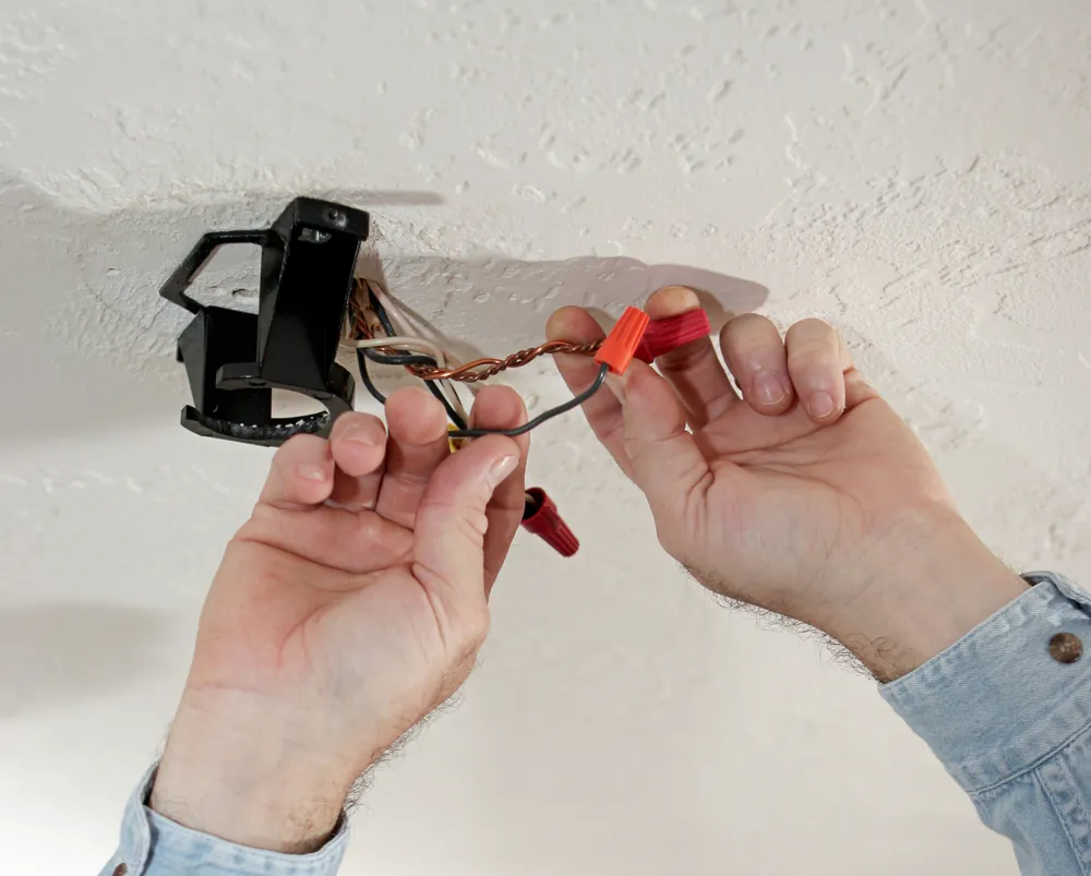 Residential electrician installing power points in a Kellyville home